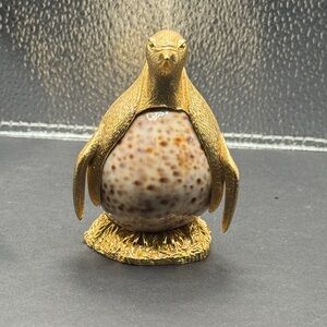 Vintage PenguinMade from a Cowrie Shell Golden head and Body. Signed